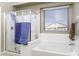 Relaxing bathroom features a separate shower, soaking tub, and a large window for natural light at 786 W Jahns Dr, Casa Grande, AZ 85122