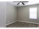 Neutral bedroom features modern ceiling fan, plush carpeting, and bright window with natural light at 786 W Jahns Dr, Casa Grande, AZ 85122
