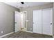 Bedroom features neutral walls, closet, carpet, and natural light from the hall at 786 W Jahns Dr, Casa Grande, AZ 85122