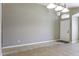 Open floor plan with tile flooring, neutral walls, and front door leading to a welcoming foyer at 786 W Jahns Dr, Casa Grande, AZ 85122