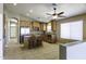 Open kitchen with granite island, stainless steel refrigerator, and bar seating offering modern amenities at 786 W Jahns Dr, Casa Grande, AZ 85122