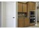 Kitchen space featuring wooden cabinetry and stainless steel appliances, providing style and functionality at 786 W Jahns Dr, Casa Grande, AZ 85122