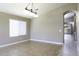 Open living area with tile floors, window, and modern chandelier lighting, bathed in natural light at 786 W Jahns Dr, Casa Grande, AZ 85122
