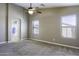 Serene main bedroom featuring soft carpeting, a ceiling fan, and private ensuite at 786 W Jahns Dr, Casa Grande, AZ 85122