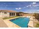Backyard oasis offers a refreshing pool and turfed areas for relaxing at 10331 E Wavelength Ave, Mesa, AZ 85212