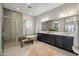 A luxurious bathroom features a large soaking tub, separate shower, and dual vanity sinks at 10331 E Wavelength Ave, Mesa, AZ 85212