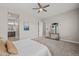 This neutral bedroom has an ensuite bathroom and ample space, creating a serene retreat at 10331 E Wavelength Ave, Mesa, AZ 85212