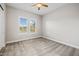 Bright bedroom with neutral tones, carpet, ceiling fan, and window with shutters at 10331 E Wavelength Ave, Mesa, AZ 85212