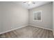 Neutral bedroom showcases plush carpet, ceiling fan, and bright window at 10331 E Wavelength Ave, Mesa, AZ 85212