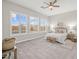 A bright bedroom with large windows provides plenty of natural light and views of the pool at 10331 E Wavelength Ave, Mesa, AZ 85212