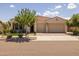 Charming single-story home with a terracotta-tiled roof and well-manicured front yard at 10331 E Wavelength Ave, Mesa, AZ 85212