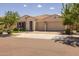 Inviting single-Gathering home featuring a three-car garage, landscaped yard, and barrel tile roof at 10331 E Wavelength Ave, Mesa, AZ 85212