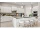 Well-appointed kitchen with white cabinetry, a sizable island, and sleek stainless steel appliances at 10331 E Wavelength Ave, Mesa, AZ 85212