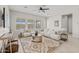 Bright living room featuring plush sofas, large windows, and an area rug at 10331 E Wavelength Ave, Mesa, AZ 85212