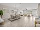 An open-concept living space features an airy Gathering room, tile flooring, and a dining area at 10331 E Wavelength Ave, Mesa, AZ 85212