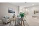 Open floorplan featuring a living room area with wood table at 10331 E Wavelength Ave, Mesa, AZ 85212