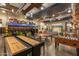Community lounge with a pool table, shuffleboard, foosball, bus stop, and gaming area at 10331 E Wavelength Ave, Mesa, AZ 85212