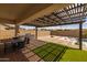 Outdoor space with covered patio including a BBQ and view of a pool at 10331 E Wavelength Ave, Mesa, AZ 85212