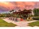 Inviting outdoor pavilion with lounge seating and lush landscaping, perfect for community gatherings at 10331 E Wavelength Ave, Mesa, AZ 85212