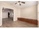 Sitting room showcases a built-in bench, wood-look floors, and an archway view at 10209 W Jessie Ln, Peoria, AZ 85383