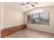 Sitting room with a built-in bench, wood-look floors, and a decorative window at 10209 W Jessie Ln, Peoria, AZ 85383