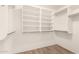Walk-in closet featuring white shelving units and hanging space at 10209 W Jessie Ln, Peoria, AZ 85383