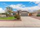 Charming single-story home featuring a desert landscaped front yard and two-car garage at 10209 W Jessie Ln, Peoria, AZ 85383