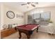 Well-lit game room with a pool table, and decorative window at 10209 W Jessie Ln, Peoria, AZ 85383
