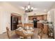 Cozy kitchen featuring stainless steel appliances, and a breakfast nook with a round wooden table at 10209 W Jessie Ln, Peoria, AZ 85383