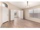 Open living area with neutral walls, wood-look flooring, and ample natural light at 10209 W Jessie Ln, Peoria, AZ 85383