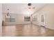 Large open floorplan with wood-look flooring, neutral walls, and ample natural light at 10209 W Jessie Ln, Peoria, AZ 85383