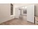 Home office area provides natural light, wood-look floors, and a hallway view at 10209 W Jessie Ln, Peoria, AZ 85383
