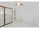 Bedroom with mirrored closet doors and tile floors at 3849 E Sheena Dr, Phoenix, AZ 85032