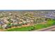 Expansive aerial view of a residential neighborhood featuring well-manicured lawns and lush green trees at 760 N Ithica St, Gilbert, AZ 85233