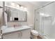 Modern bathroom featuring a walk-in shower with subway tile and a vanity with light fixtures at 760 N Ithica St, Gilbert, AZ 85233