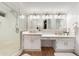Bright bathroom featuring a walk-in shower, quartz counters, and dual vanity at 760 N Ithica St, Gilbert, AZ 85233