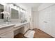 Bright bathroom featuring a dual vanity and wood-look flooring at 760 N Ithica St, Gilbert, AZ 85233
