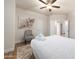 Light-filled bedroom featuring light wall colors, wood floors and plush rug at 760 N Ithica St, Gilbert, AZ 85233