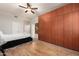 Cozy bedroom featuring wood floors, built-in cabinets, and contemporary lighting at 760 N Ithica St, Gilbert, AZ 85233