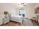 Bright bedroom with white furnishings, wood-look flooring and great natural light at 760 N Ithica St, Gilbert, AZ 85233