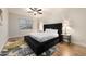 Modern bedroom featuring a large bed, stylish rug, ceiling fan and bright natural light at 760 N Ithica St, Gilbert, AZ 85233