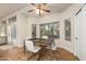 Bright breakfast nook with a wood table and a view of the pool at 760 N Ithica St, Gilbert, AZ 85233