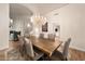Dining room with a chandelier and an open doorway with natural light at 760 N Ithica St, Gilbert, AZ 85233