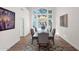 Elegant dining room with a chandelier, large windows and stylish decor at 760 N Ithica St, Gilbert, AZ 85233