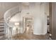 Bright foyer featuring a winding staircase, wood floors, and an open floor plan at 760 N Ithica St, Gilbert, AZ 85233