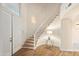 Bright foyer featuring a winding staircase, wood floors, and an open floor plan at 760 N Ithica St, Gilbert, AZ 85233