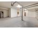 Well-lit garage with ample storage, epoxy floors, and convenient access to interior at 760 N Ithica St, Gilbert, AZ 85233