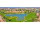 Picturesque golf course aerial featuring a tranquil lake, rolling green fairways, and mature trees at 760 N Ithica St, Gilbert, AZ 85233