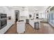 Kitchen with an island, stainless steel appliances, and an open view to the Gathering room at 760 N Ithica St, Gilbert, AZ 85233