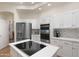 Bright kitchen featuring white cabinetry, stainless steel appliances, and modern finishes at 760 N Ithica St, Gilbert, AZ 85233
